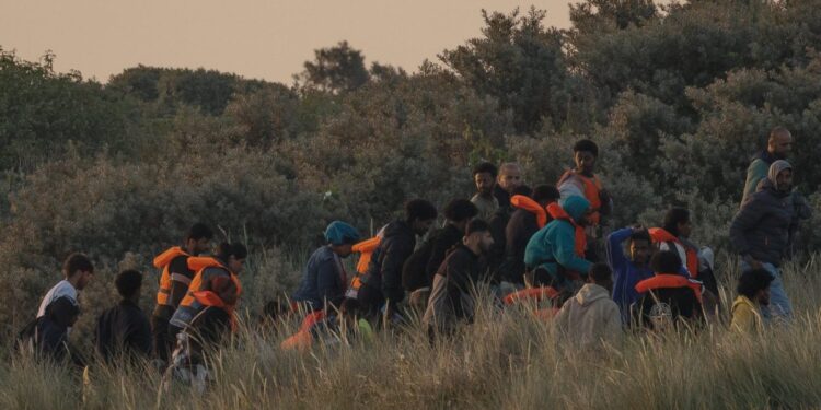 U.K. unveils new asylum rules: 20-year wait and asset seizures