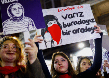 People hold placards as they attend a protest against femicide, sexual violence and all gender-based violence to mark the International Day for Elimination of Violence Against Women, in Istanbul on November 25. — Reuters