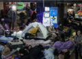 People take shelter inside a metro station during a Russian missile and drone strike in Kyiv, Ukraine, November 25. — Reuters