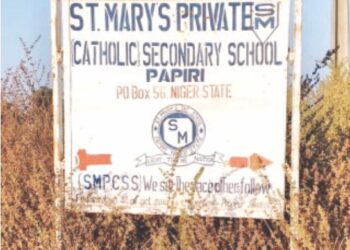 PAPIRI (Nigeria): A sign directing people to St. Mary’s School, which was the site of the kidnapping of more than 300 children and staff a couple of days ago.—Reuters