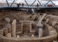 Tourists visit the Gobeklitepe excavation site, widely regarded with Karahantepe as keys to understanding the birth of symbolic thought, social complexity and monumental architecture thousands of years before cities or states existed, near the southeastern city of Sanliurfa, Turkey