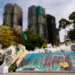 A painting depicting a photograph taken by Reuters photographer Tyrone Siu sits at a makeshift flower memorial nearby to the Wang Fuk Court housing complex residents after the deadly fire, in Tai Po, Hong Kong, China [Reuters]