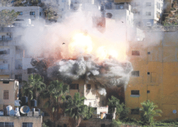 Smoke billows as Israeli forces demolish the house of Abdul Karim Snobar, who was detained earlier this year after being accused of plotting bus bombings in the occupied West Bank city of Nablus.—AFP