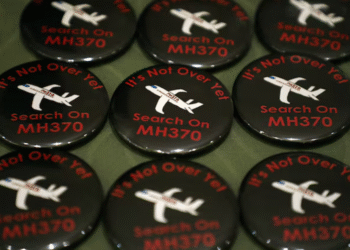 Badges are displayed during the sixth annual remembrance event for the missing Malaysia Airlines flight MH370 in Putrajaya, Malaysia, March 7, 2020. REUTERS
