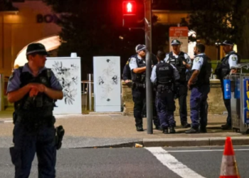 Police officers gather at the scene of a shooting incident at Bondi Beach, Sydney, Australia, December 14, 2025.— Reuters