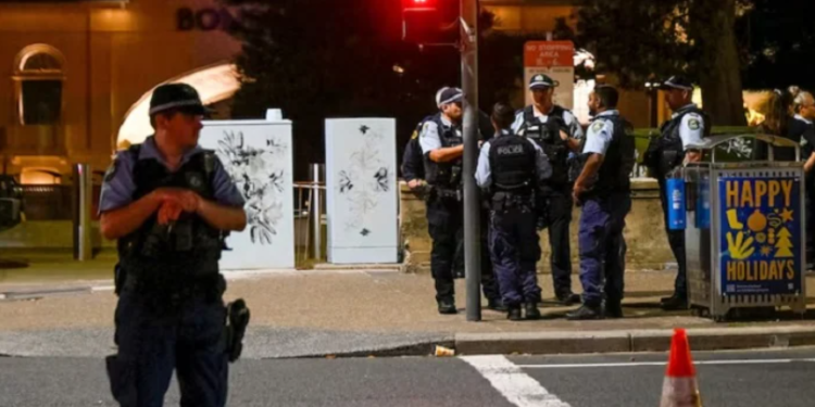 Police officers gather at the scene of a shooting incident at Bondi Beach, Sydney, Australia, December 14, 2025.— Reuters