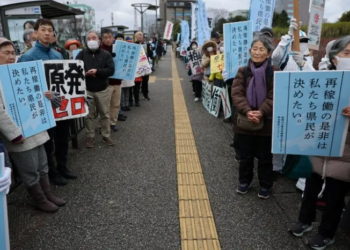 Protesters take part in a rally near Niigata prefectural government office building before voting takes place in the prefectural assembly on a partial restart of the Tokyo Electric Power Company’s (TEPCO) in Niigata, Japan on December 22, 2025. — Reuters