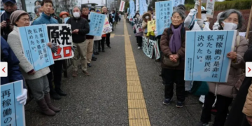 Protesters take part in a rally near Niigata prefectural government office building before voting takes place in the prefectural assembly on a partial restart of the Tokyo Electric Power Company’s (TEPCO) in Niigata, Japan on December 22, 2025. — Reuters