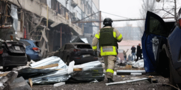 A rescuer walks at the site of a midday Russian missile strike, amid Russia's attack on Ukraine, in Dnipro, Ukraine