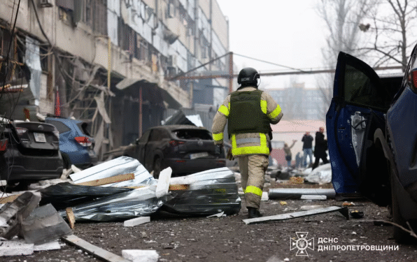 A rescuer walks at the site of a midday Russian missile strike, amid Russia's attack on Ukraine, in Dnipro, Ukraine