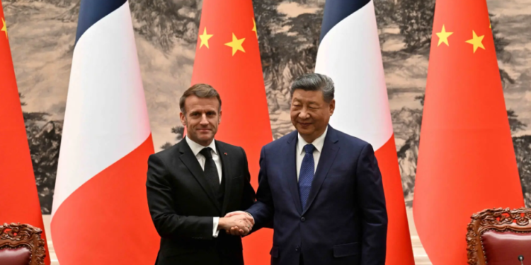 France President Emmanuel Macron (L) and Chinese President Xi Jinping (R) shake hands after a joint press conference at the Great Hall of the People in Beijing on December 4, 2025. – Reuters