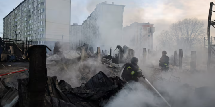 Emergency responders work at the site of a warehouse that was struck during a night of Russian missile and drone strikes, amid Russia's attack on Ukraine, in Novi Petrivtsi, outside Kyiv, Ukraine, December 6, 2025. REUTERS