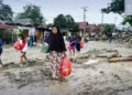 Flash floods in Indonesia kill 14; four still missing