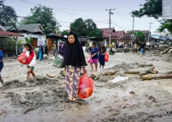 Flash floods in Indonesia kill 14; four still missing