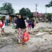 Flash floods in Indonesia kill 14; four still missing