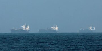 Three vessels hit by projectiles in Strait of Hormuz