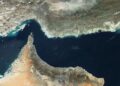 Battered by US-Israeli strikes, Iran claims control of Hormuz strait