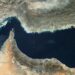 Battered by US-Israeli strikes, Iran claims control of Hormuz strait