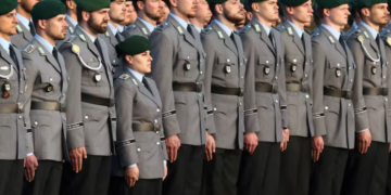 Germany works to clarify new rules on fighting-age men leaving country