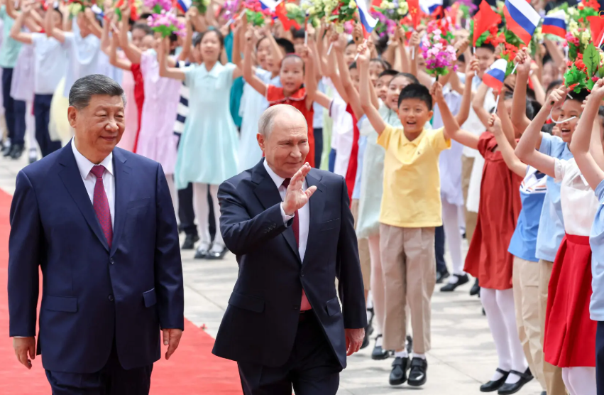 Putin, Xi Praise ‘Unyielding’ China-Russia Ties After Trump’s Beijing Visit