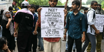Modi announces exam reform panel after education minister resigns amid protests